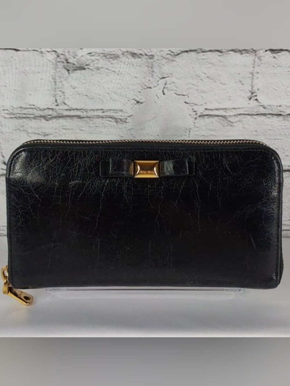 'MIU MIU' BOW-FRONT LEATHER WALLET FULL-ZIP  DISTRESSED ONYX